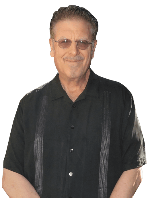 A man in black shirt and glasses smiling for the camera.